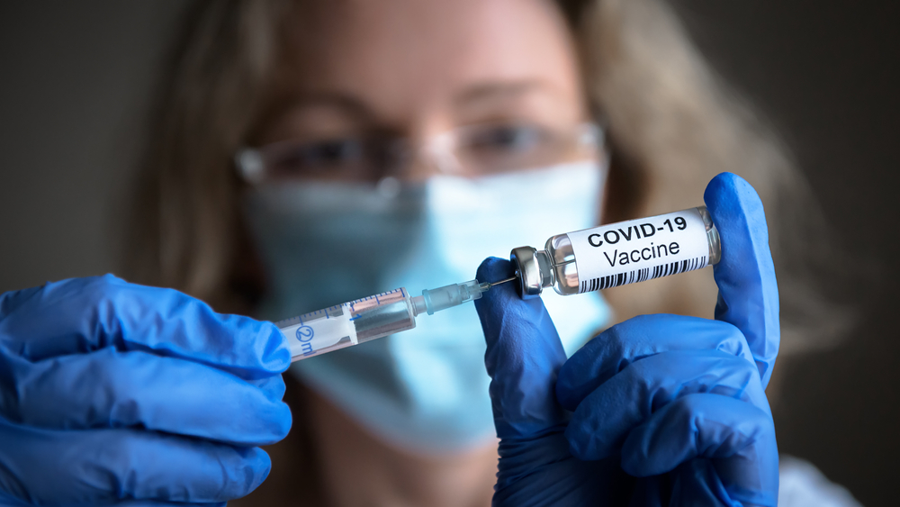 All eyes on our future vaccination strategy as COVID-19 spikes - Featured Image