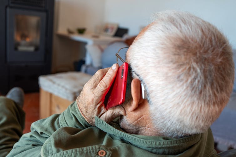 An older man on the phone.